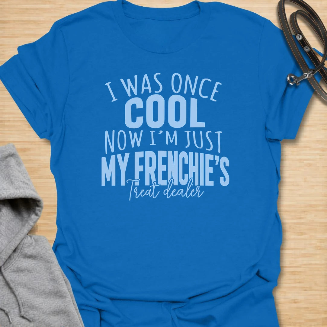 This I Was Once Cool Now I’m Just My Frenchie’s Treat Dealer t-shirt is made for French Bulldog lovers who know their little dog has completely taken over their priorities. Featuring bold mixed typography and a funny treat-dealer message, this design has a relatable dog-parent feel that Frenchie owners will instantly understand. Perfect for Frenchie moms, Frenchie dads, French Bulldog owners, rescue dog lovers, and anyone whose pockets are basically full of dog treats now.