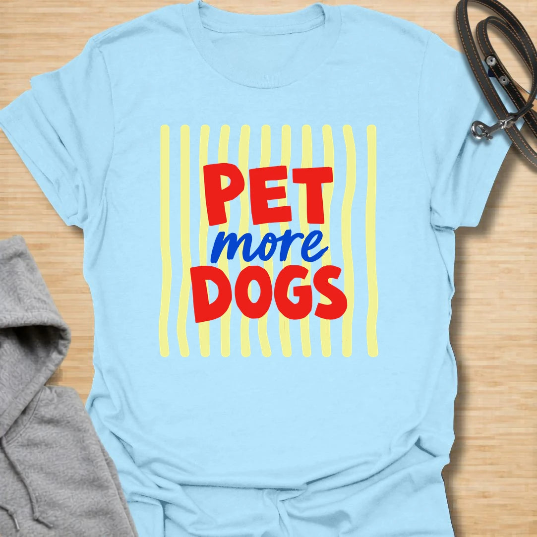 This pet more dogs t-shirt is bright, simple, and perfect for people who believe every day needs more dogs. The bold red and blue lettering gives the design a playful retro feel that is easy to read and fun to wear. It is a great choice for dog moms, dog dads, rescue supporters, groomers, walkers, and anyone who stops to pet every dog they meet. A cheerful everyday dog lover shirt with a clear message and plenty of personality.