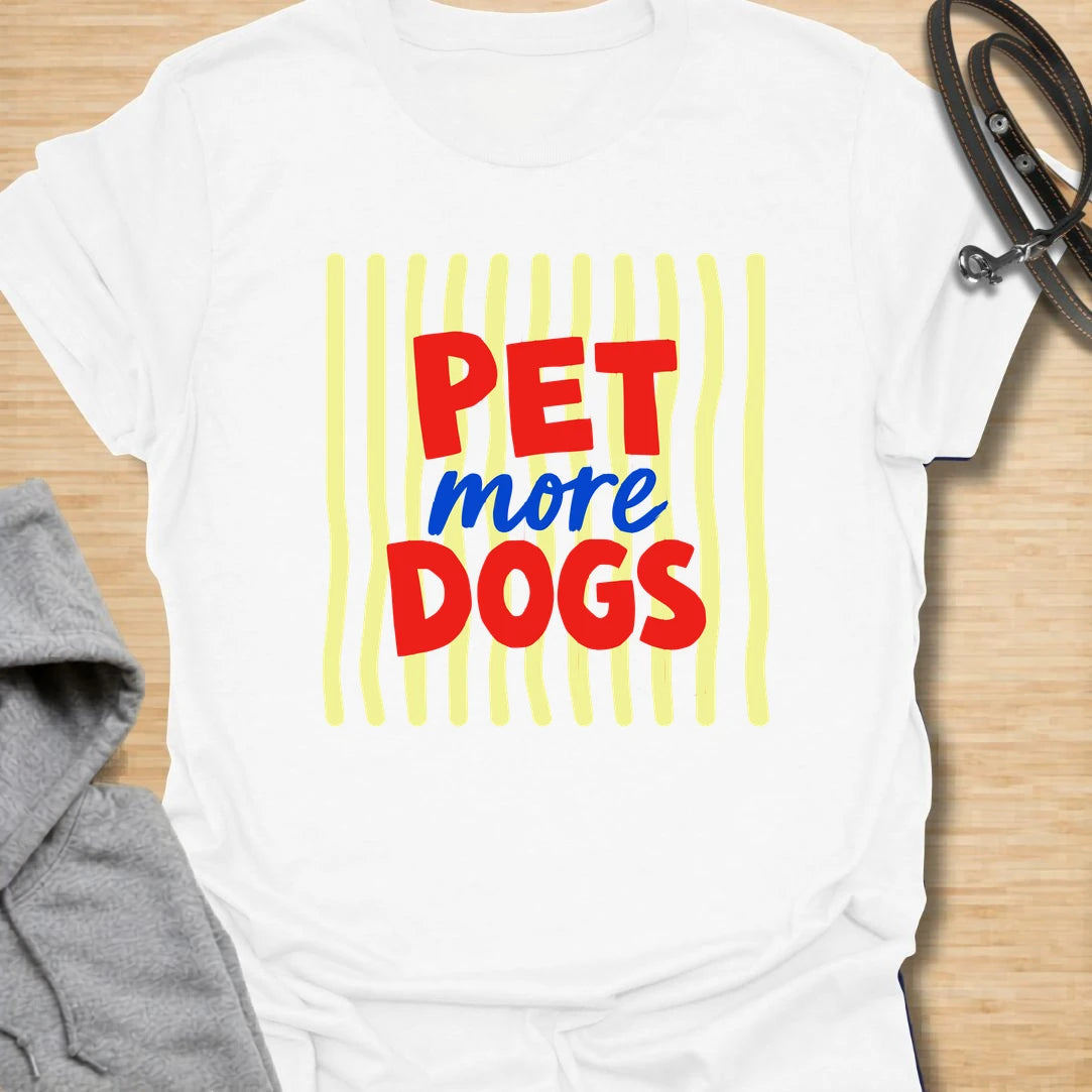 This pet more dogs t-shirt is bright, simple, and perfect for people who believe every day needs more dogs. The bold red and blue lettering gives the design a playful retro feel that is easy to read and fun to wear. It is a great choice for dog moms, dog dads, rescue supporters, groomers, walkers, and anyone who stops to pet every dog they meet. A cheerful everyday dog lover shirt with a clear message and plenty of personality.
