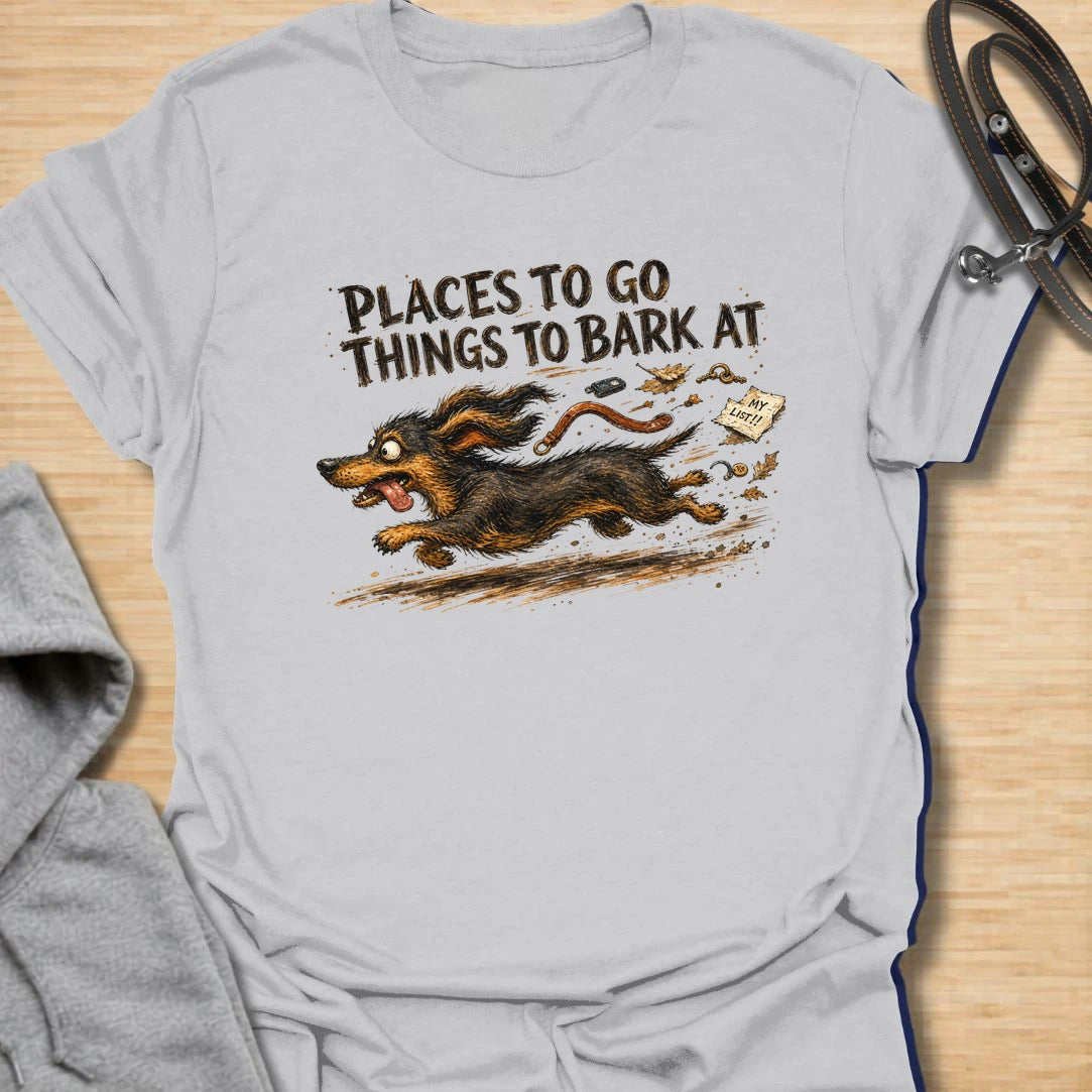 A chaotic dachshund T-shirt for little dogs with busy schedules and plenty of opinions. The energetic artwork captures a determined sausage dog racing toward its next completely unnecessary barking appointment. A funny gift for dachshund moms, dachshund dads, and anyone living with a tiny four-legged troublemaker.
