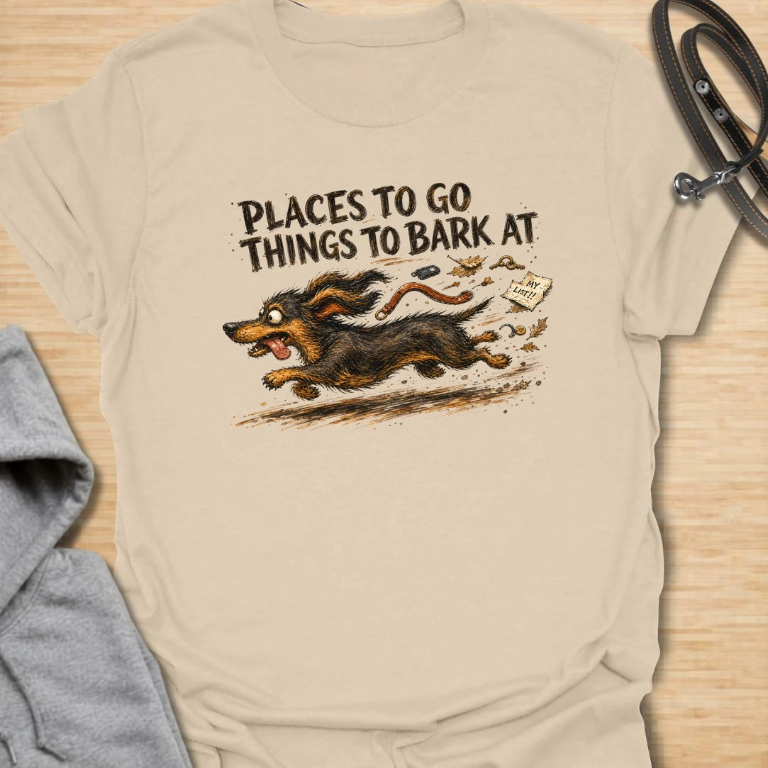 A chaotic dachshund T-shirt for little dogs with busy schedules and plenty of opinions. The energetic artwork captures a determined sausage dog racing toward its next completely unnecessary barking appointment. A funny gift for dachshund moms, dachshund dads, and anyone living with a tiny four-legged troublemaker.