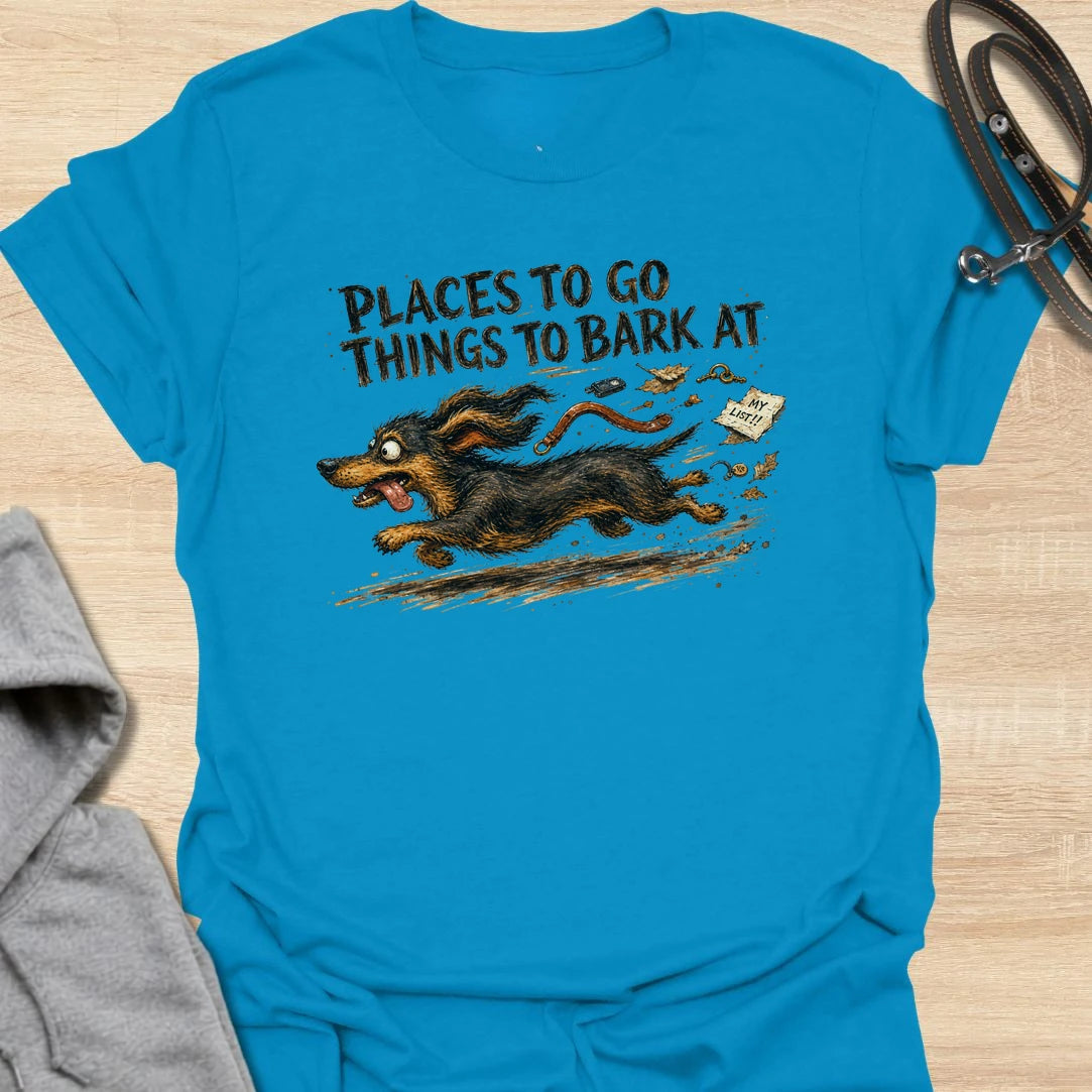 A chaotic dachshund T-shirt for little dogs with busy schedules and plenty of opinions. The energetic artwork captures a determined sausage dog racing toward its next completely unnecessary barking appointment. A funny gift for dachshund moms, dachshund dads, and anyone living with a tiny four-legged troublemaker.