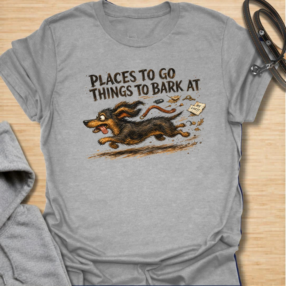 A chaotic dachshund T-shirt for little dogs with busy schedules and plenty of opinions. The energetic artwork captures a determined sausage dog racing toward its next completely unnecessary barking appointment. A funny gift for dachshund moms, dachshund dads, and anyone living with a tiny four-legged troublemaker.
