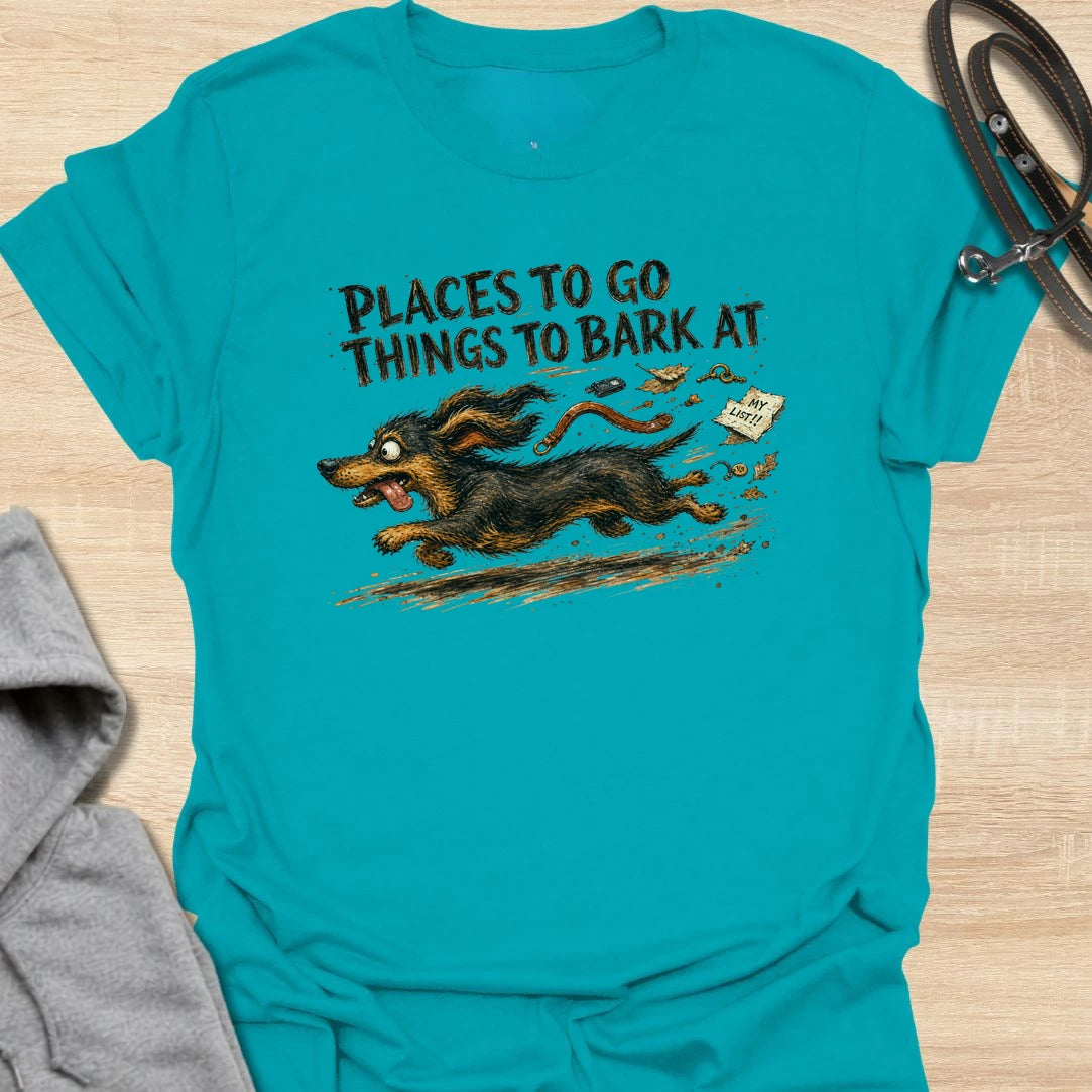 A chaotic dachshund T-shirt for little dogs with busy schedules and plenty of opinions. The energetic artwork captures a determined sausage dog racing toward its next completely unnecessary barking appointment. A funny gift for dachshund moms, dachshund dads, and anyone living with a tiny four-legged troublemaker.