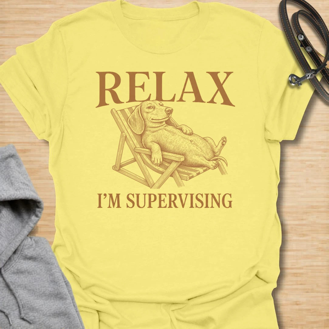 Relax I’m Supervising t-shirt for dachshund lovers who know their dog is always watching, judging, and doing absolutely no actual work. The vintage-style dachshund lounging in a chair gives the design a funny, laid-back look with classic doxie attitude. It is perfect for dachshund moms, doxie dads, and dog lovers whose pet believes supervision is a full-time job. A great casual shirt for anyone who loves lazy dog humor, stubborn dachshunds, and designs with a relaxed vintage feel.