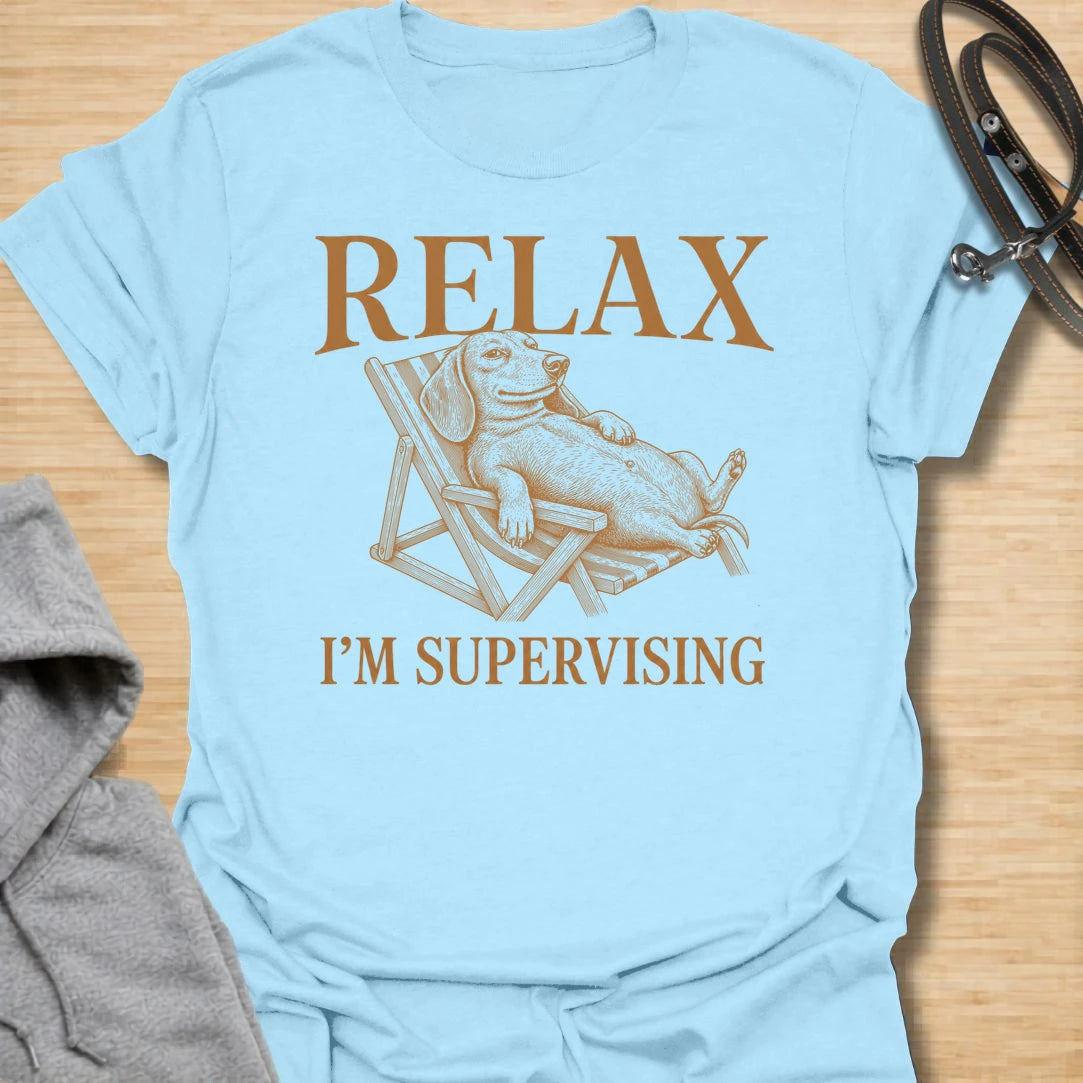 Relax I’m Supervising t-shirt for dachshund lovers who know their dog is always watching, judging, and doing absolutely no actual work. The vintage-style dachshund lounging in a chair gives the design a funny, laid-back look with classic doxie attitude. It is perfect for dachshund moms, doxie dads, and dog lovers whose pet believes supervision is a full-time job. A great casual shirt for anyone who loves lazy dog humor, stubborn dachshunds, and designs with a relaxed vintage feel.