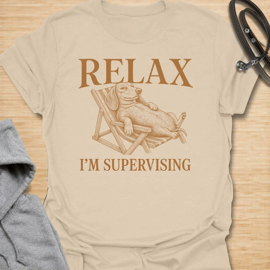 Relax I’m Supervising t-shirt for dachshund lovers who know their dog is always watching, judging, and doing absolutely no actual work. The vintage-style dachshund lounging in a chair gives the design a funny, laid-back look with classic doxie attitude. It is perfect for dachshund moms, doxie dads, and dog lovers whose pet believes supervision is a full-time job. A great casual shirt for anyone who loves lazy dog humor, stubborn dachshunds, and designs with a relaxed vintage feel.
