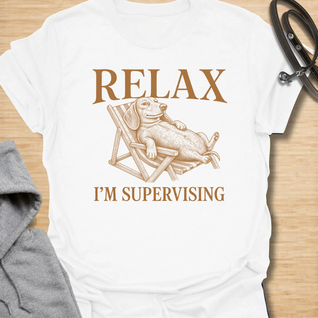 WRelax I’m Supervising t-shirt for dachshund lovers who know their dog is always watching, judging, and doing absolutely no actual work. The vintage-style dachshund lounging in a chair gives the design a funny, laid-back look with classic doxie attitude. It is perfect for dachshund moms, doxie dads, and dog lovers whose pet believes supervision is a full-time job. A great casual shirt for anyone who loves lazy dog humor, stubborn dachshunds, and designs with a relaxed vintage feel.