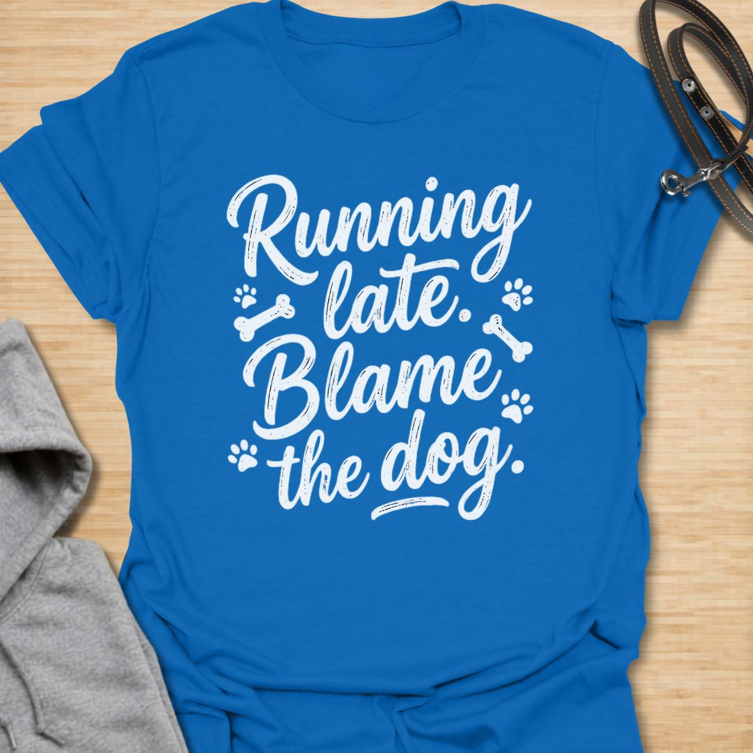 Funny dog lover t-shirt featuring the phrase “Running late. Blame the dog.” A perfect tee for dog moms, dog dads, rescue dog owners, and pet parents who know dogs always come first.