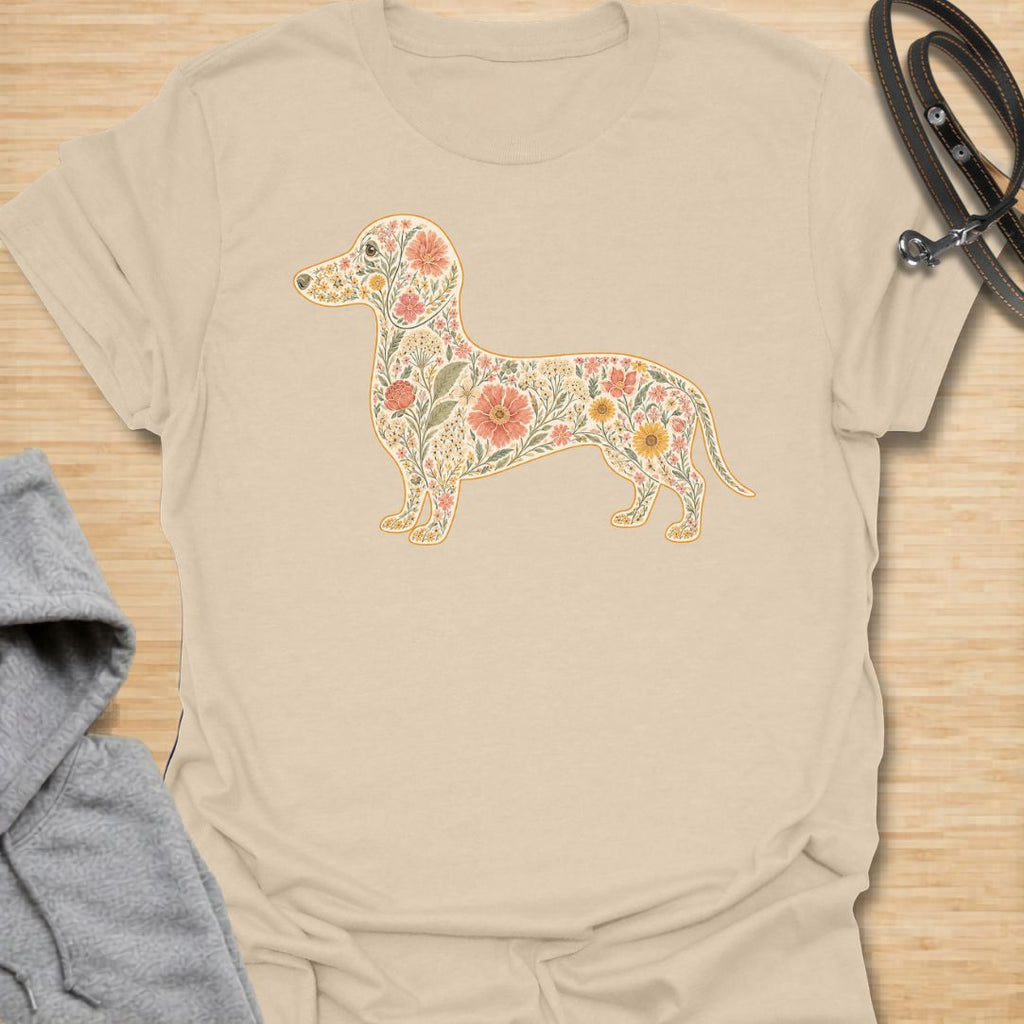 This Floral Dachshund t-shirt is made for doxie lovers who want a beautiful, botanical take on their favorite long dog. Featuring a dachshund silhouette filled with intricate flowers, leaves, vines, and vintage-style floral details, this design blends dog-lover charm with soft garden-inspired artwork. Perfect for dachshund moms, dachshund dads, wiener dog lovers, sausage dog fans, botanical art lovers, and anyone who loves both dogs and flowers.