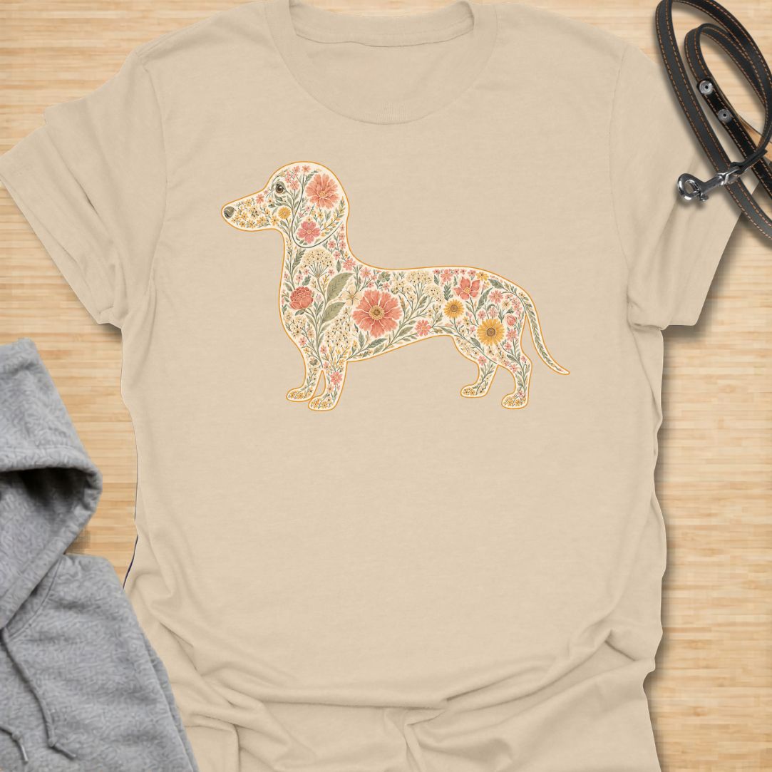 This Floral Dachshund t-shirt is made for doxie lovers who want a beautiful, botanical take on their favorite long dog. Featuring a dachshund silhouette filled with intricate flowers, leaves, vines, and vintage-style floral details, this design blends dog-lover charm with soft garden-inspired artwork. Perfect for dachshund moms, dachshund dads, wiener dog lovers, sausage dog fans, botanical art lovers, and anyone who loves both dogs and flowers.