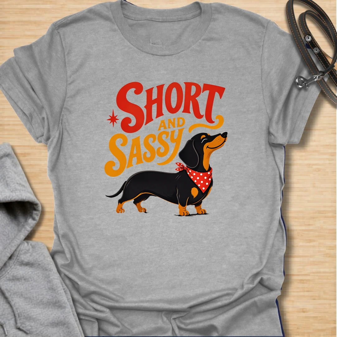 Short and Sassy Dachshund t-shirt for dog lovers who know tiny legs can come with huge personality. This fun retro design features a confident wiener dog with bold vintage lettering, perfect for dachshund owners with a sense of humor. A great gift for dachshund moms, doxie dads, sausage dog fans, and anyone who loves their little dog’s big attitude.