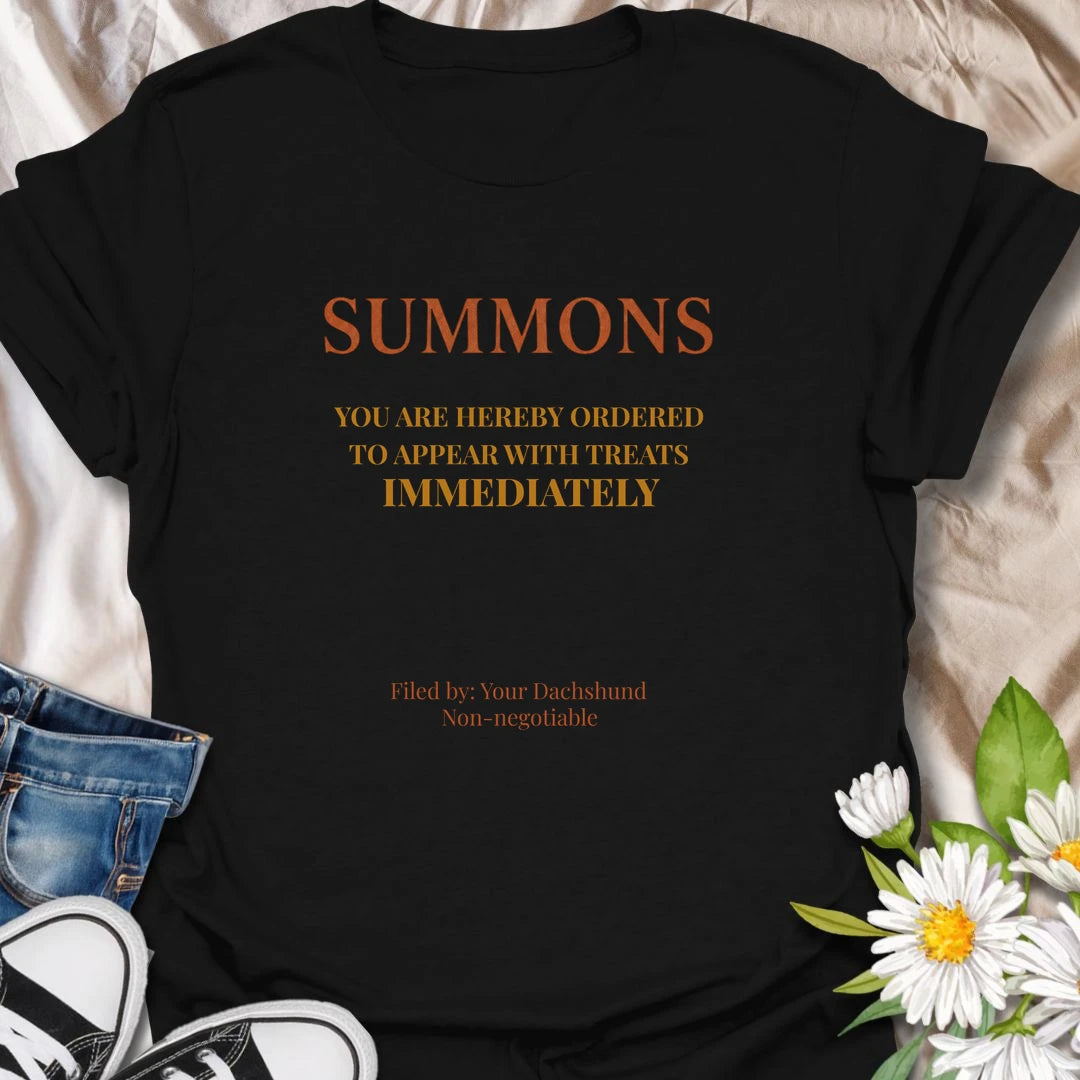 You have been officially ordered to appear with treats immediately, and your dachshund will accept no excuses. This funny legal-style dog T-shirt is made for owners familiar with non-negotiable snack demands. A clever gift for dachshund moms, dads, and anyone serving a tiny four-legged authority figure.