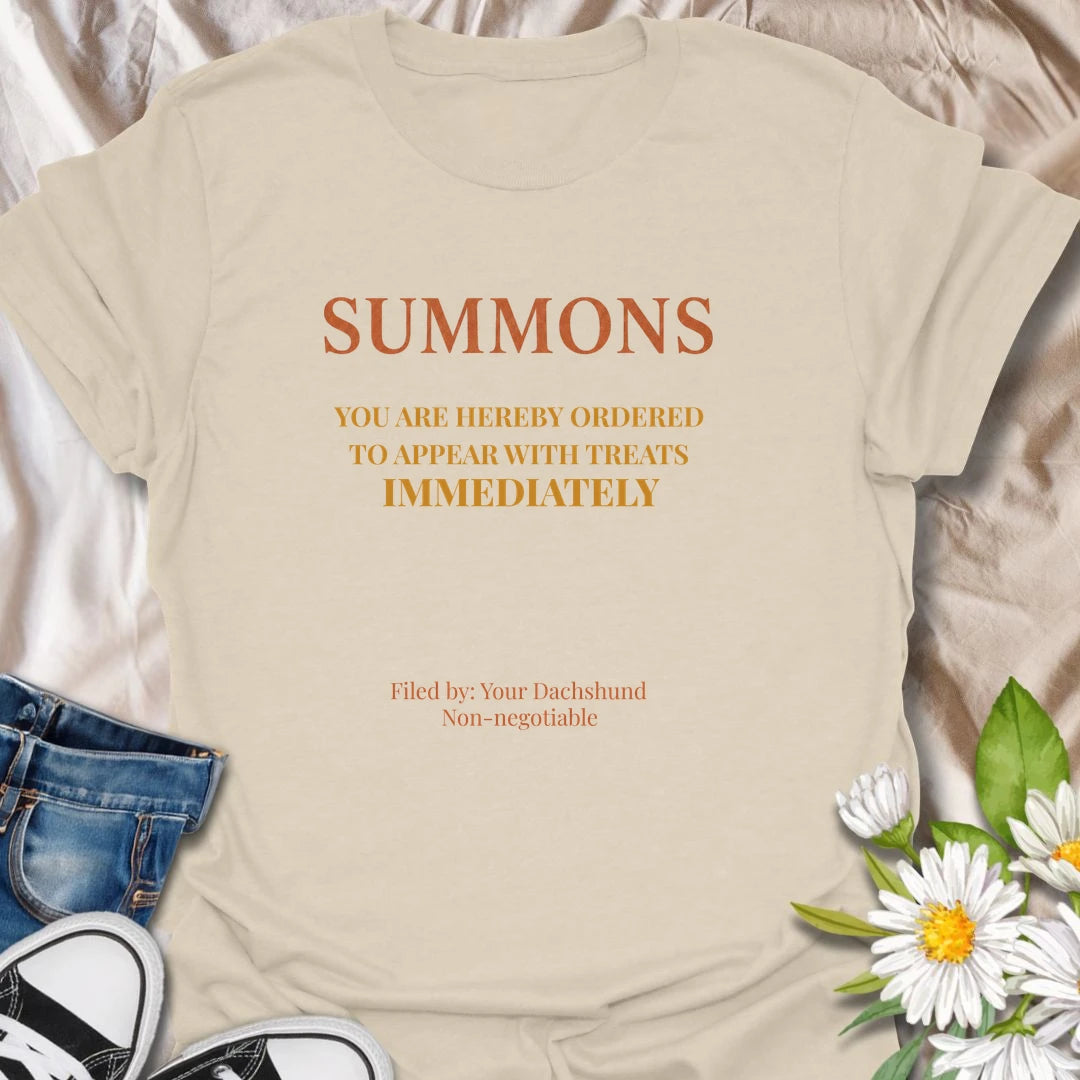 You have been officially ordered to appear with treats immediately, and your dachshund will accept no excuses. This funny legal-style dog T-shirt is made for owners familiar with non-negotiable snack demands. A clever gift for dachshund moms, dads, and anyone serving a tiny four-legged authority figure.