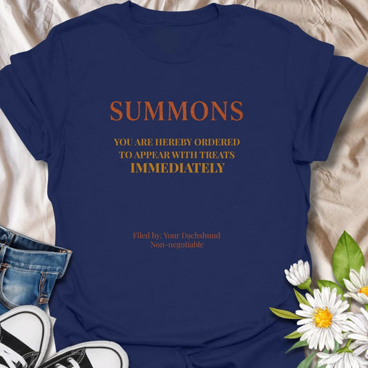 You have been officially ordered to appear with treats immediately, and your dachshund will accept no excuses. This funny legal-style dog T-shirt is made for owners familiar with non-negotiable snack demands. A clever gift for dachshund moms, dads, and anyone serving a tiny four-legged authority figure.