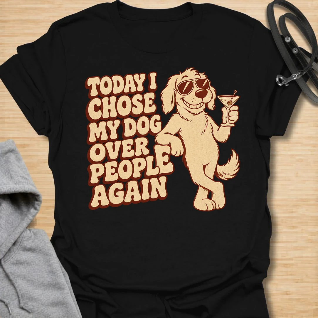 This Today I Chose My Dog Over People Again t-shirt is made for dog lovers who would rather hang out with their pup than deal with unnecessary social plans. Featuring a cool cartoon dog in sunglasses holding a drink, with bold retro lettering and a playful vintage vibe, this design is funny, snarky, and full of dog-parent attitude. Perfect for dog moms, dog dads, rescue dog owners, introverts, pet parents, and anyone who proudly chooses dogs over people. Black