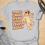 This Today I Chose My Dog Over People Again t-shirt is made for dog lovers who would rather hang out with their pup than deal with unnecessary social plans. Featuring a cool cartoon dog in sunglasses holding a drink, with bold retro lettering and a playful vintage vibe, this design is funny, snarky, and full of dog-parent attitude. Perfect for dog moms, dog dads, rescue dog owners, introverts, pet parents, and anyone who proudly chooses dogs over people. Ice Grey