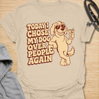 This Today I Chose My Dog Over People Again t-shirt is made for dog lovers who would rather hang out with their pup than deal with unnecessary social plans. Featuring a cool cartoon dog in sunglasses holding a drink, with bold retro lettering and a playful vintage vibe, this design is funny, snarky, and full of dog-parent attitude. Perfect for dog moms, dog dads, rescue dog owners, introverts, pet parents, and anyone who proudly chooses dogs over people. Sand