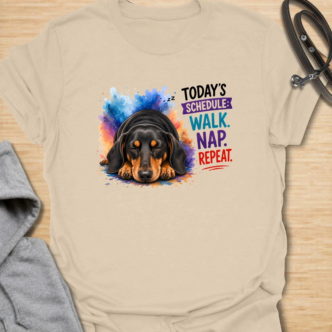 Walk Nap Repeat t-shirt for dachshund lovers whose dog’s perfect schedule is simple: walk, nap, repeat. This cute sleeping doxie design has a colorful playful style and is perfect for dog moms, sausage dog owners, and pet parents who love relaxed dog humor. A sweet gift for dachshund fans and anyone whose pup lives for walks and naps.