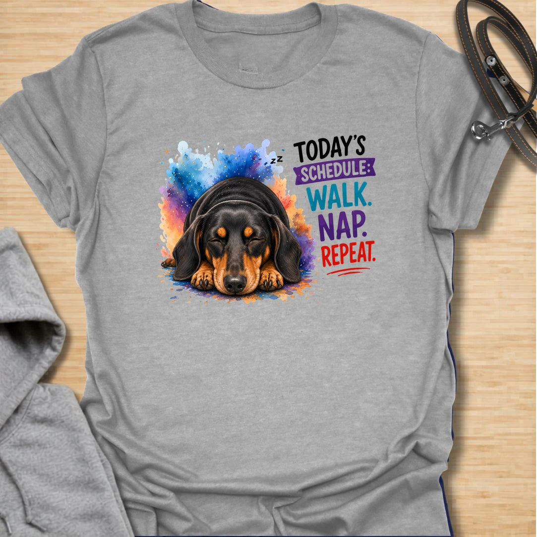 Walk Nap Repeat t-shirt for dachshund lovers whose dog’s perfect schedule is simple: walk, nap, repeat. This cute sleeping doxie design has a colorful playful style and is perfect for dog moms, sausage dog owners, and pet parents who love relaxed dog humor. A sweet gift for dachshund fans and anyone whose pup lives for walks and naps.