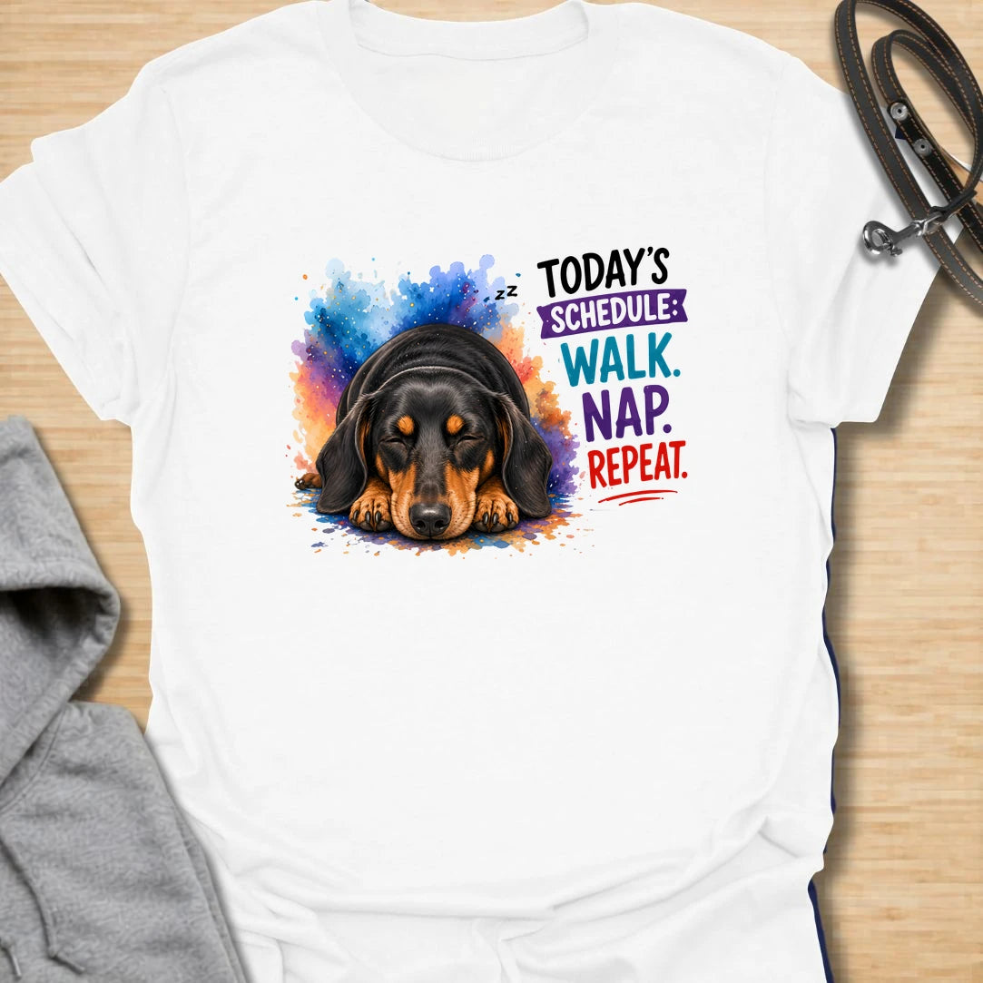 Walk Nap Repeat t-shirt for dachshund lovers whose dog’s perfect schedule is simple: walk, nap, repeat. This cute sleeping doxie design has a colorful playful style and is perfect for dog moms, sausage dog owners, and pet parents who love relaxed dog humor. A sweet gift for dachshund fans and anyone whose pup lives for walks and naps.