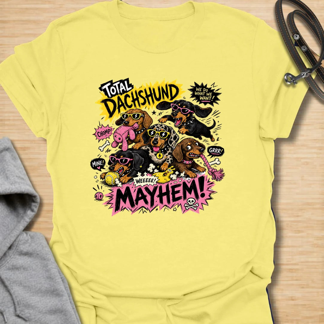 Dachshund Mayhem t-shirt for doxie lovers who live with tiny chaos, loud opinions, and nonstop sausage dog energy. This bold comic-style design features a wild pack of dachshunds causing total mayhem with toys, sunglasses, and attitude. Perfect for dachshund moms, multi-dog homes, and anyone who loves loud, funny dog designs.