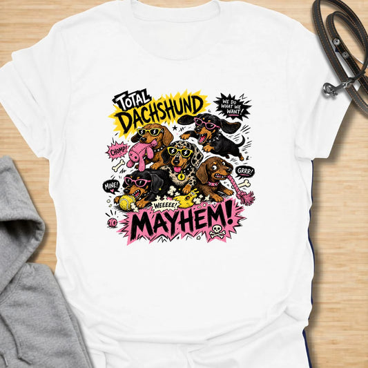 Dachshund Mayhem t-shirt for doxie lovers who live with tiny chaos, loud opinions, and nonstop sausage dog energy. This bold comic-style design features a wild pack of dachshunds causing total mayhem with toys, sunglasses, and attitude. Perfect for dachshund moms, multi-dog homes, and anyone who loves loud, funny dog designs.