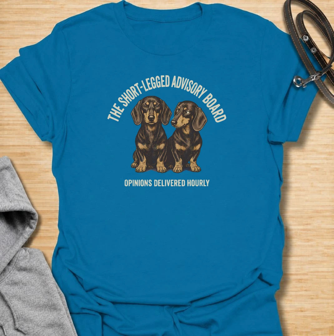For dachshund owners who never have to wonder what their dogs think — because the opinions arrive all day long. This funny dachshund T-shirt features “The Short-Legged Advisory Board” with the line “Opinions Delivered Hourly” and two wonderfully serious doxies. Perfect for anyone who shares their home with small dogs, big personalities and absolutely no shortage of commentary. A fun vintage-style dachshund tee for sausage dog lovers who know they are never really in charge.