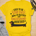 This Used To Be Stressed Now I’m Blessed And Dachshund Obsessed t-shirt is made for dachshund lovers who know life got a whole lot better with a sausage dog in it. Featuring playful stacked typography, a long dachshund illustration, and a fun feel-good message, this design has a cheerful and relatable dog-lover vibe. Perfect for dachshund moms, dachshund dads, wiener dog fans, doxie owners, and anyone who proudly admits they are completely dachshund obsessed.