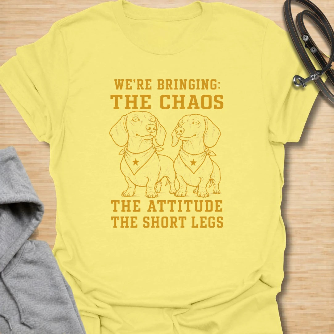 This We’re Bringing The Chaos t-shirt is made for dachshund lovers who know two little long dogs can bring double the attitude and double the noise. Featuring two dachshunds in bandanas with bold stacked lettering, this design has a funny dog-parent feel for anyone who lives with tiny-legged trouble. Perfect for dachshund moms, dachshund dads, multi-dog homes, wiener dog fans, and rescue dog lovers.