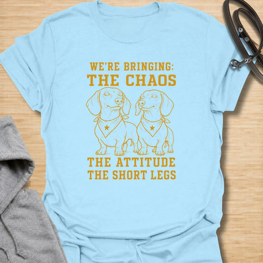 This We’re Bringing The Chaos t-shirt is made for dachshund lovers who know two little long dogs can bring double the attitude and double the noise. Featuring two dachshunds in bandanas with bold stacked lettering, this design has a funny dog-parent feel for anyone who lives with tiny-legged trouble. Perfect for dachshund moms, dachshund dads, multi-dog homes, wiener dog fans, and rescue dog lovers.