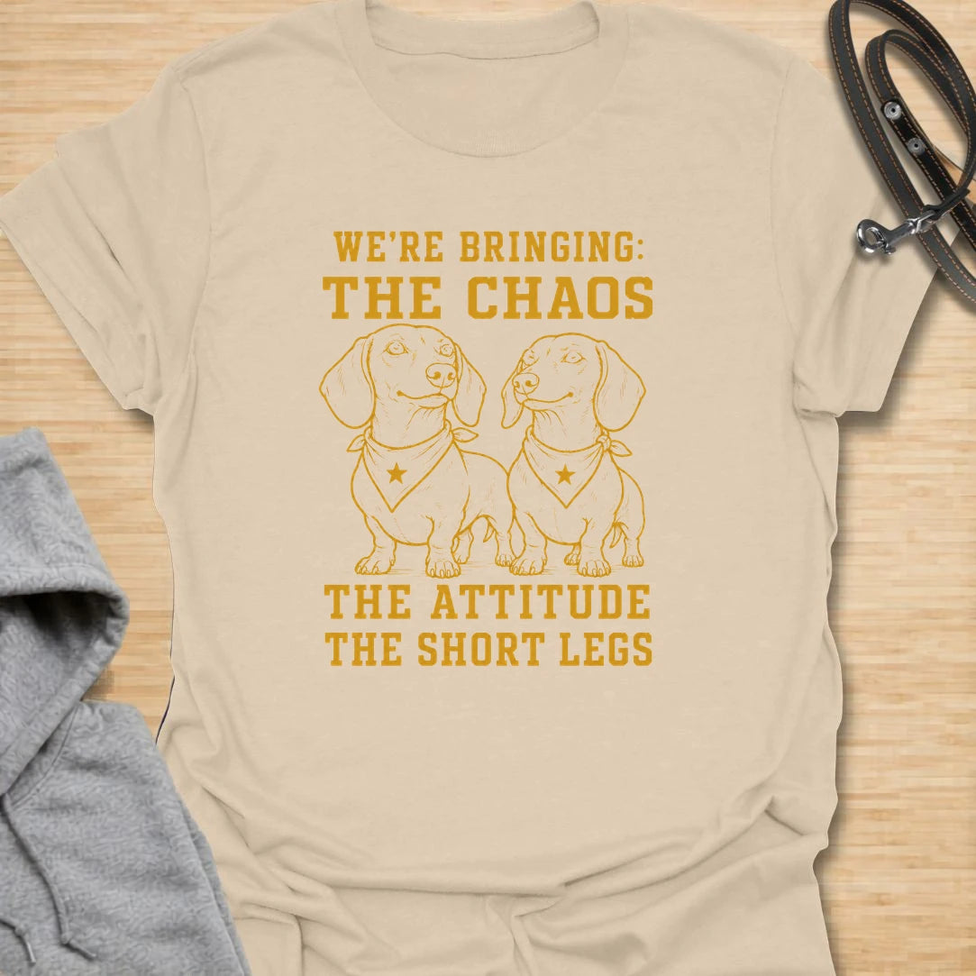 This We’re Bringing The Chaos t-shirt is made for dachshund lovers who know two little long dogs can bring double the attitude and double the noise. Featuring two dachshunds in bandanas with bold stacked lettering, this design has a funny dog-parent feel for anyone who lives with tiny-legged trouble. Perfect for dachshund moms, dachshund dads, multi-dog homes, wiener dog fans, and rescue dog lovers.