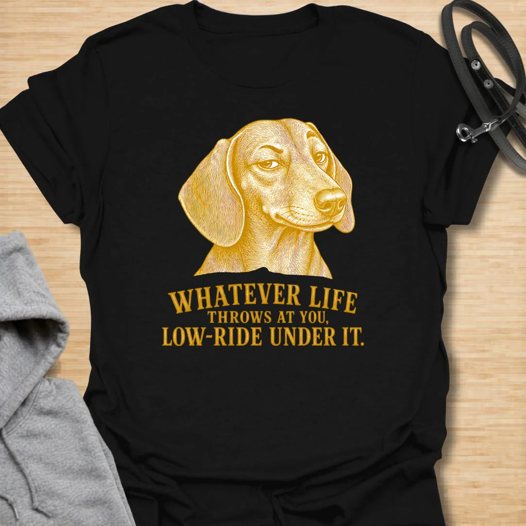 This Whatever Life Throws At You Low-Ride Under It t-shirt is made for dachshund lovers who know short legs can be a whole advantage. Featuring a vintage-style dachshund portrait and bold lettering, this design has a funny, resilient dog-parent feel. Perfect for dachshund moms, dachshund dads, wiener dog fans, rescue dog lovers, and anyone who loves a low-riding dog with a big personality.