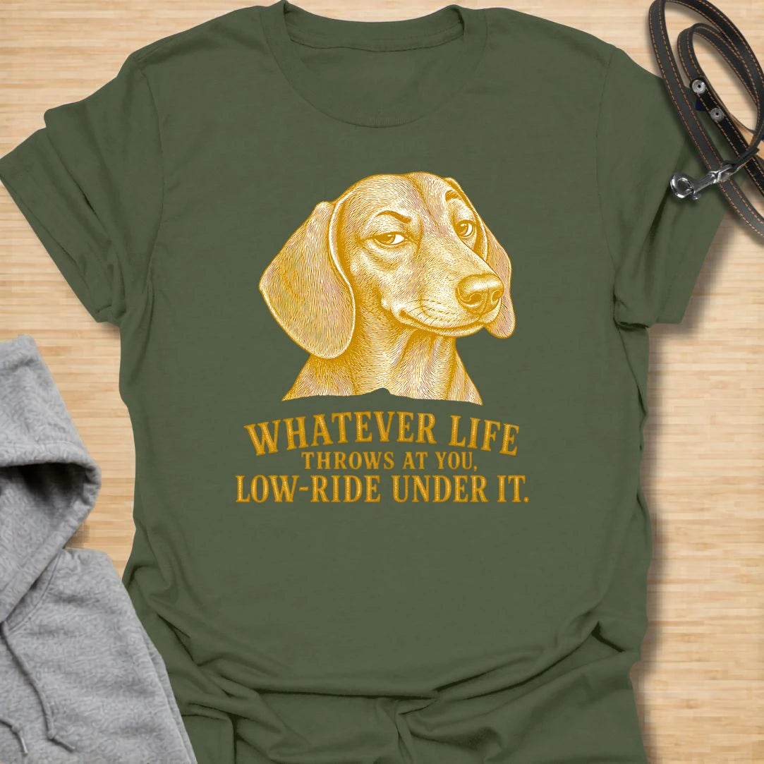 This Whatever Life Throws At You Low-Ride Under It t-shirt is made for dachshund lovers who know short legs can be a whole advantage. Featuring a vintage-style dachshund portrait and bold lettering, this design has a funny, resilient dog-parent feel. Perfect for dachshund moms, dachshund dads, wiener dog fans, rescue dog lovers, and anyone who loves a low-riding dog with a big personality.