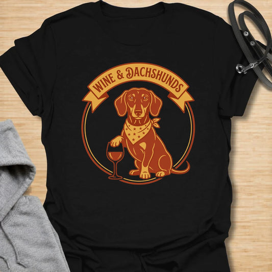 This wine and dachshunds t-shirt is made for doxie lovers who enjoy a good glass of wine and even better dog company. The warm vintage badge design features a dachshund with a wine glass, giving it a cozy, playful feel. It is perfect for dachshund moms, wine lovers, dog moms, and anyone whose ideal evening includes a long dog and a favorite drink. A fun gift for birthdays, dog mom friends, wine nights, or casual weekends at home.
