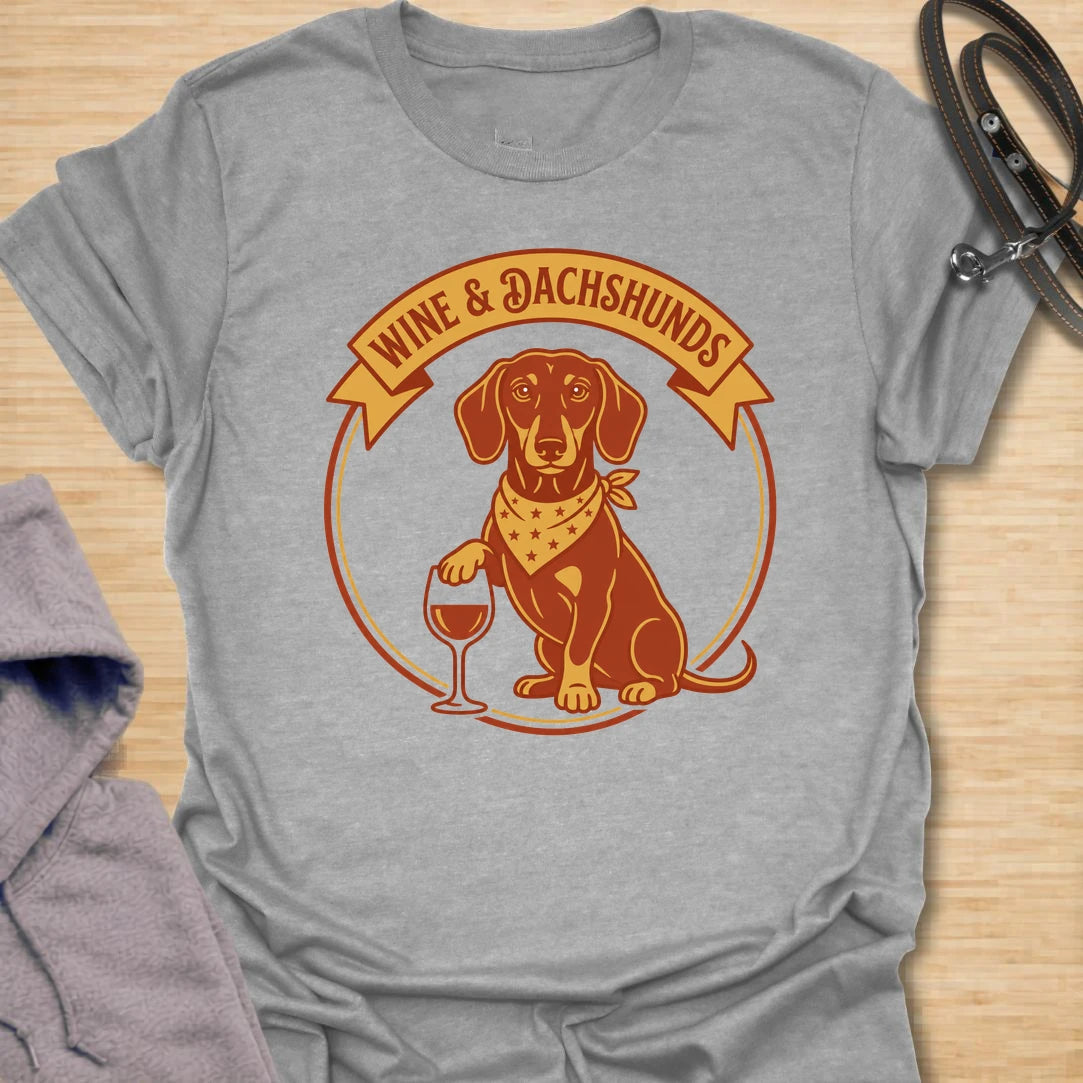 This wine and dachshunds t-shirt is made for doxie lovers who enjoy a good glass of wine and even better dog company. The warm vintage badge design features a dachshund with a wine glass, giving it a cozy, playful feel. It is perfect for dachshund moms, wine lovers, dog moms, and anyone whose ideal evening includes a long dog and a favorite drink. A fun gift for birthdays, dog mom friends, wine nights, or casual weekends at home.